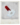 Polaroid Kamm mit rotem PVC Griff und weißem Kopf